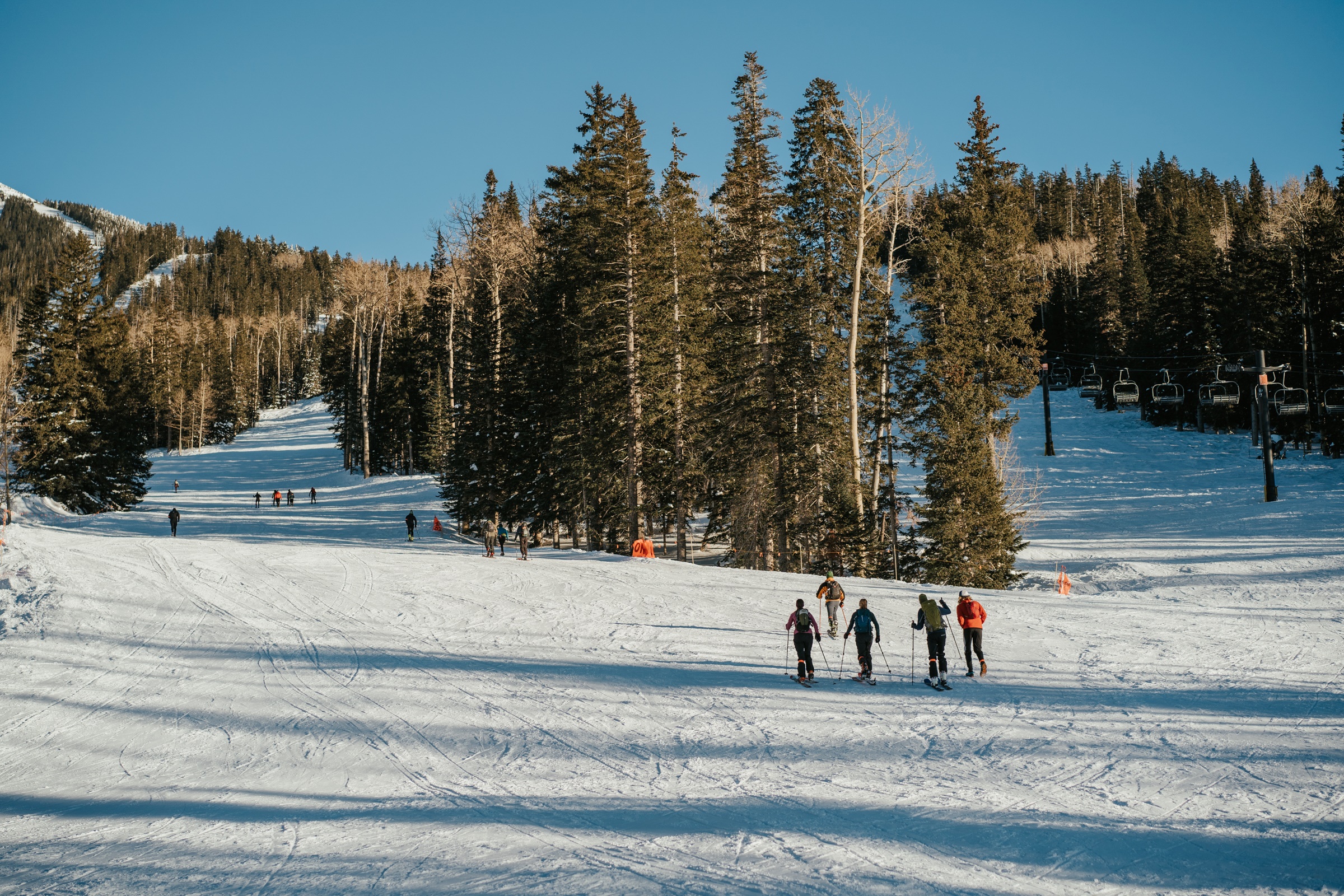 Skiiers going uphill at ski resort